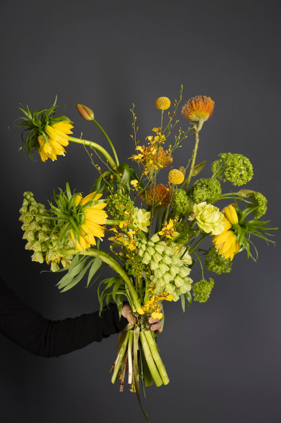 yellow and green garden-style bouquet with sculptural seasonal flowers