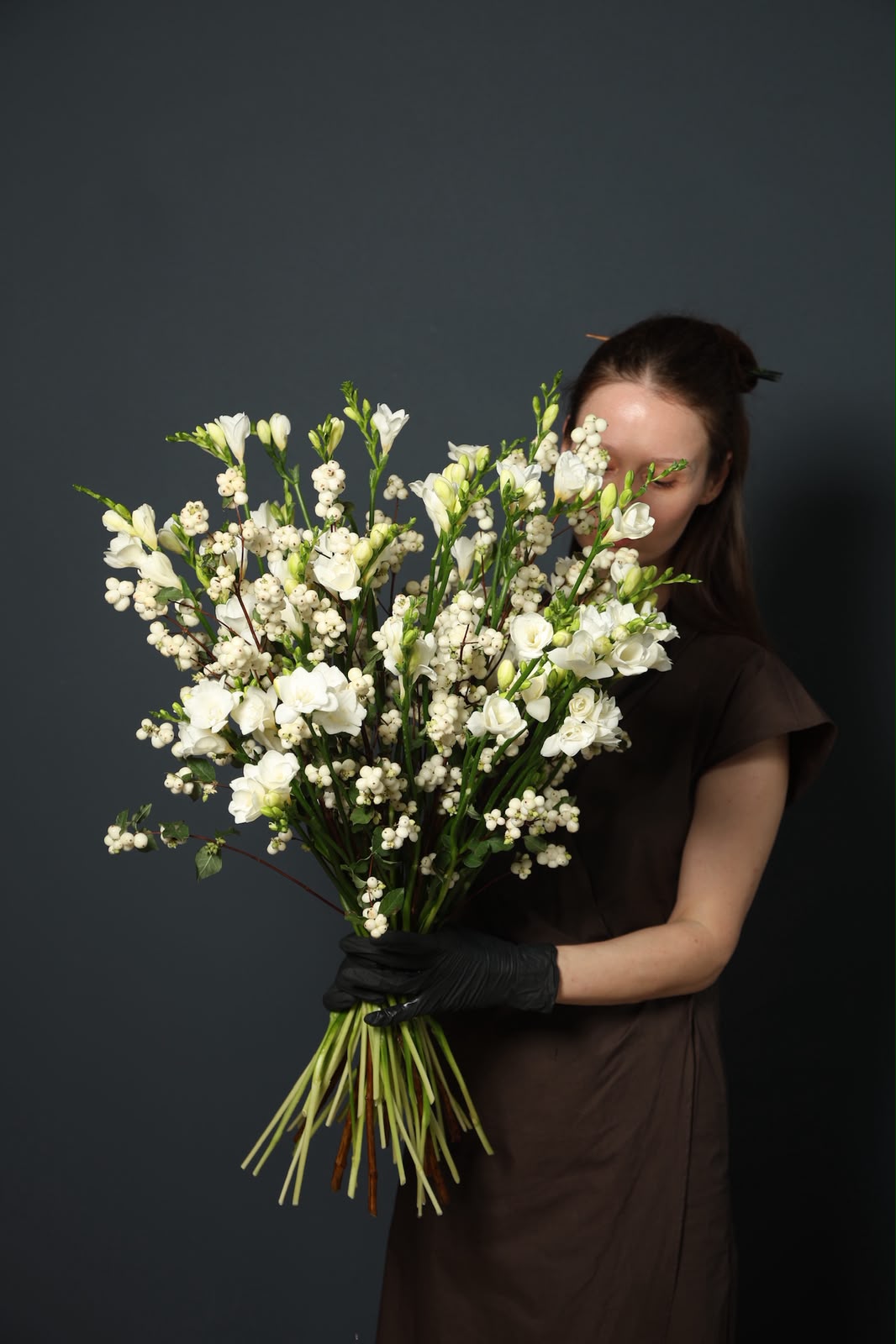Pearl Cloud white snowberry and freesia bouquet with a light natural shape
