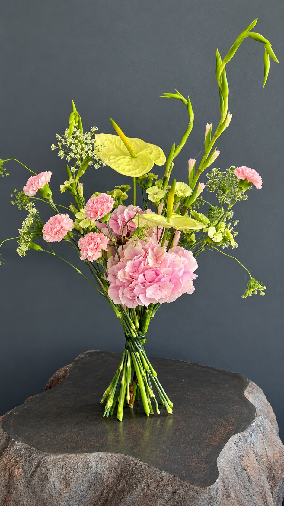 Primavera designer bouquet with pink hydrangea, green anthurium, carnations and seasonal flowers