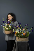 Small and large Wild Spring Basket flower arrangements shown together