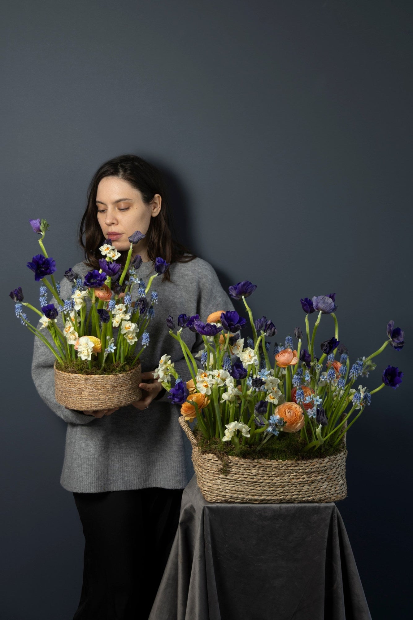 Small and large Wild Spring Basket flower arrangements shown together